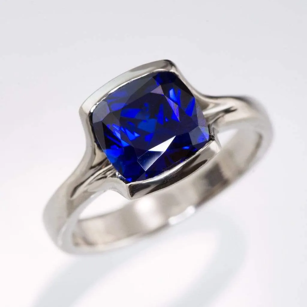 Cushion Cut Blue Sapphire Fold Solitaire Engagement Ring